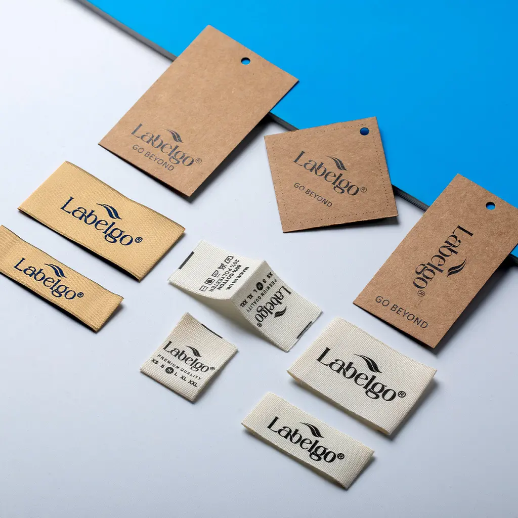 Custom Clothing Labels 22 Brown kraft hang tag labels arranged on blue background.