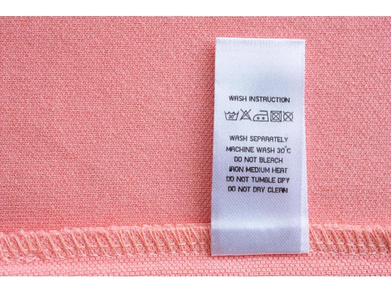 Care Labels shown as a textile label manufacturing example with printed fabric label and care label