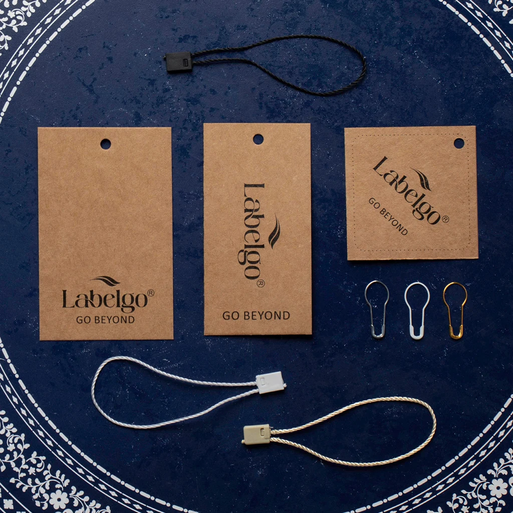 Custom Hang Tags: Luxury Embossing & Retail Stringing 3 Custom Hang Tags shown as a textile label manufacturing example with hang tag size label and patch label application