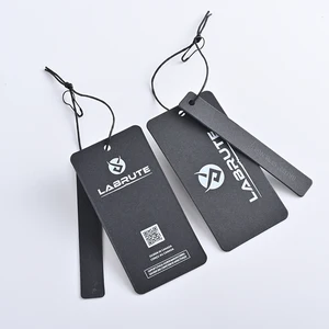 Custom Hang Tags: Luxury Embossing & Retail Stringing 2 Custom Hang Tags shown as a textile label manufacturing example with printed fabric label and care label