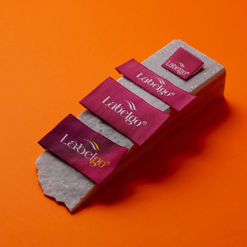 Custom Labels for Fashion Businesses shown as a textile label manufacturing example with hang tag size label and patch label application