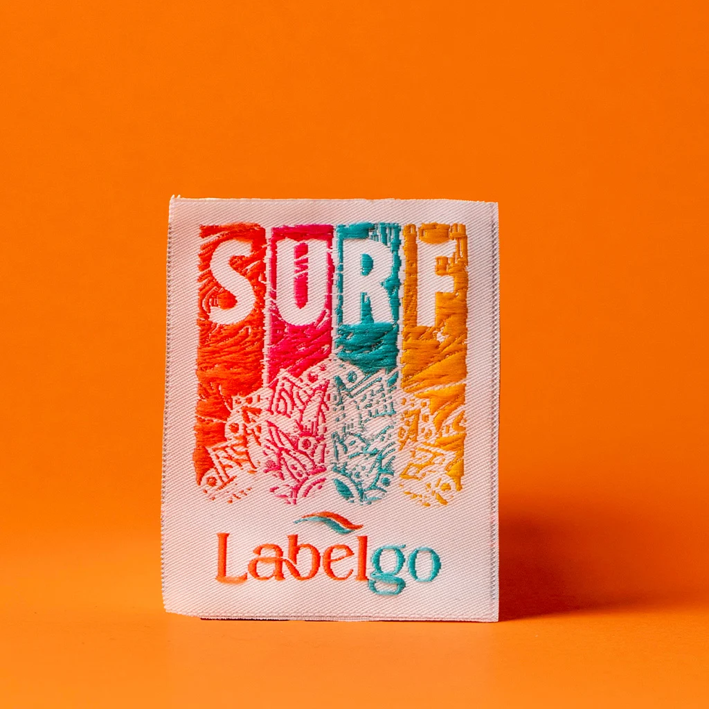 Retro SURF Woven Clothing Label on Orange manufactured by LabelGo